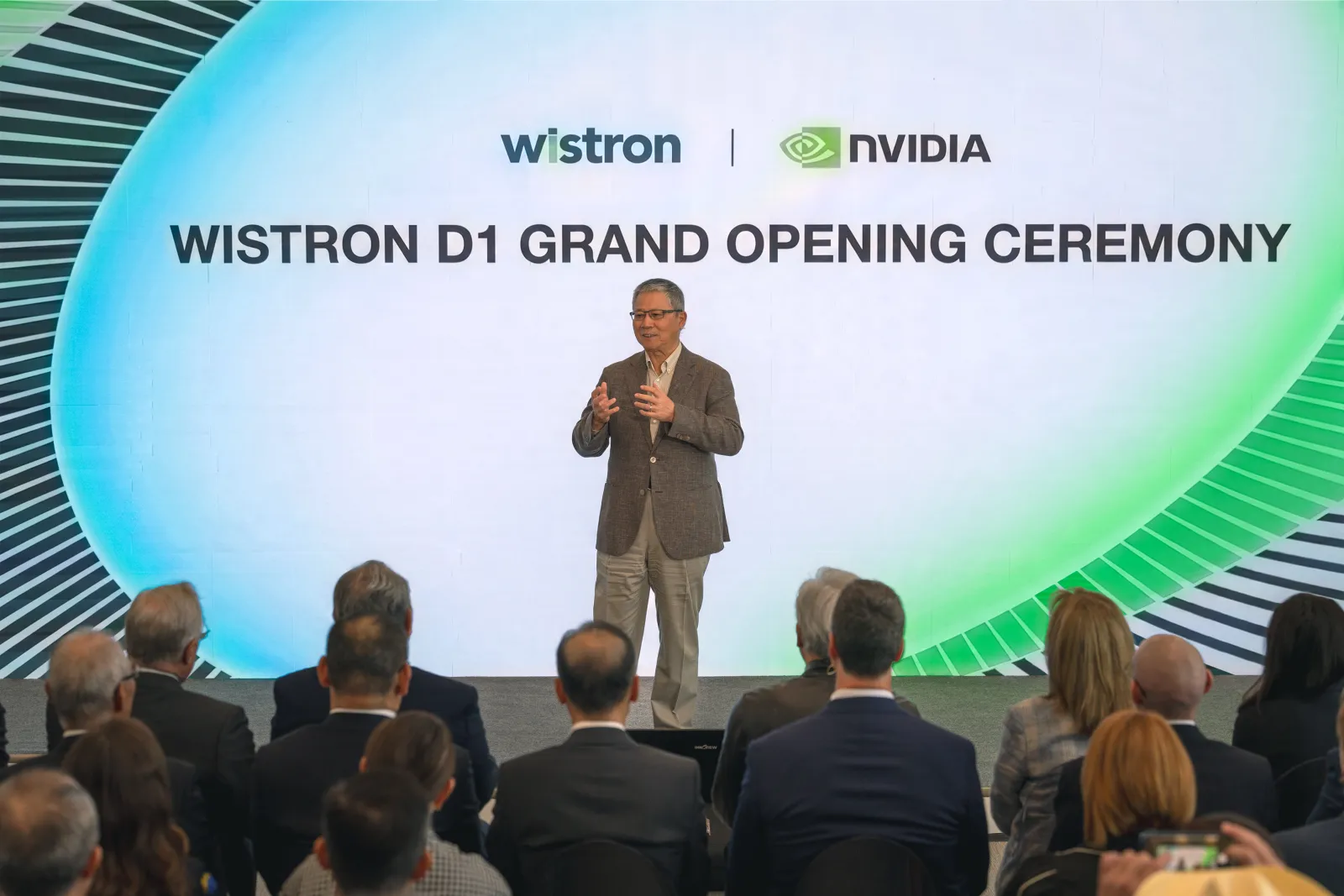 Speaker on stage at the Wistron D1 Grand Opening Ceremony with Wistron and NVIDIA branding