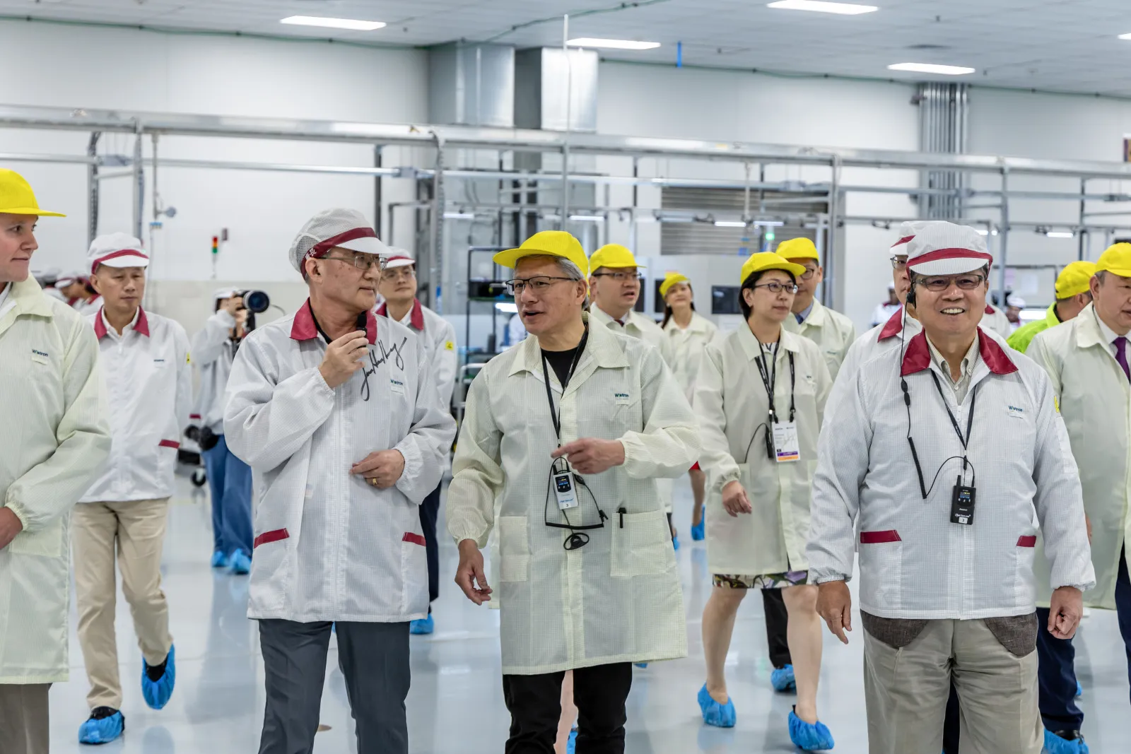 NVIDIA CEO Jensen Huang touring the Wistron D1 manufacturing floor with the team