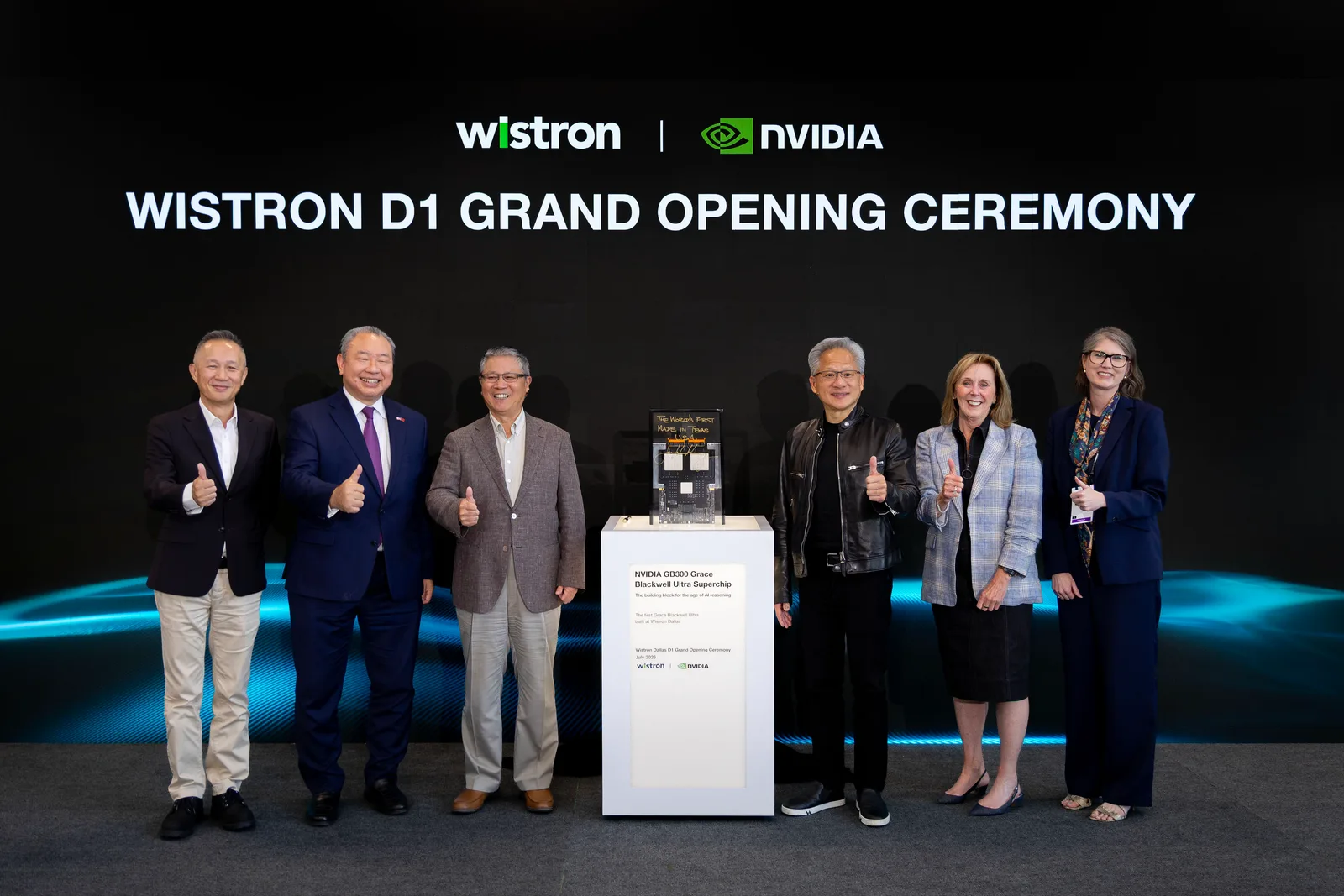 Wistron and NVIDIA executives posing with the GB300 Grace Blackwell Ultra Superchip at the D1 Grand Opening Ceremony
